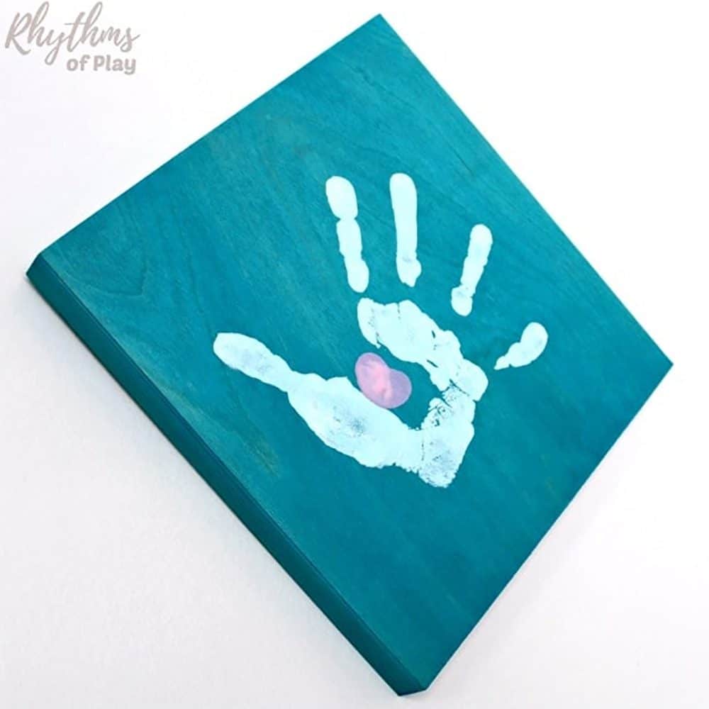 Handprint thumbprint heart craft.