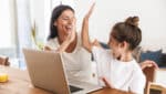 Mom and daughter doing Kids Club activities online.